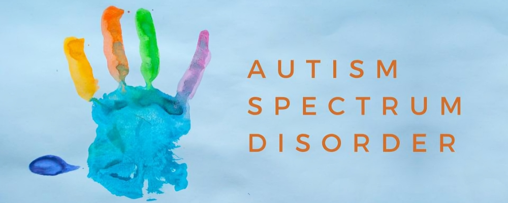 A child's rainbow-coloured handprint beside the words Autism Spectrum Disorder.